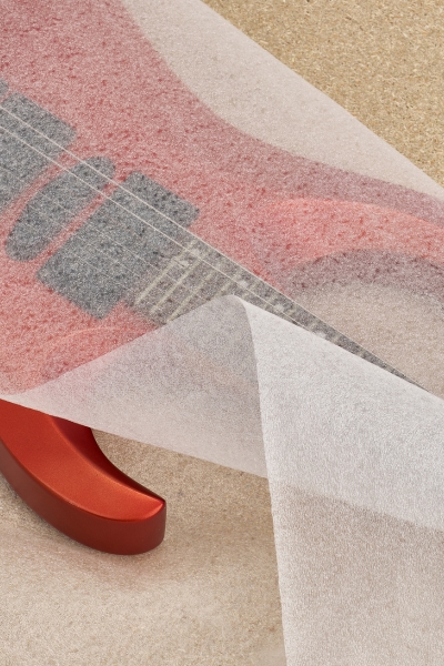 pe-foam-guitar-protection Red electric guitar protected with a sheet of polyethylene foam for scratch prevention and safe transport
