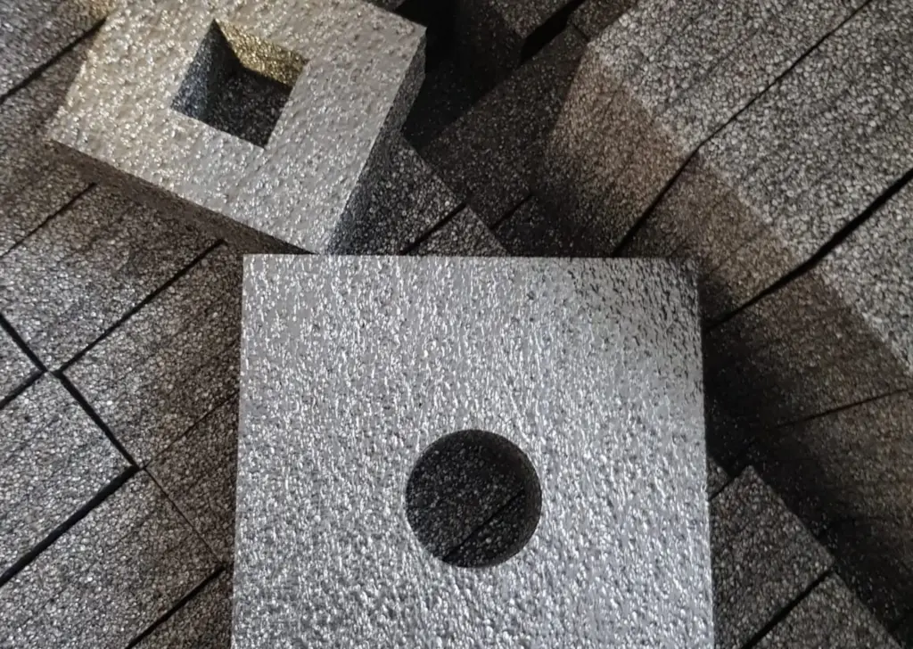 Custom black PE foam inserts with precision-cut shapes for protective packaging